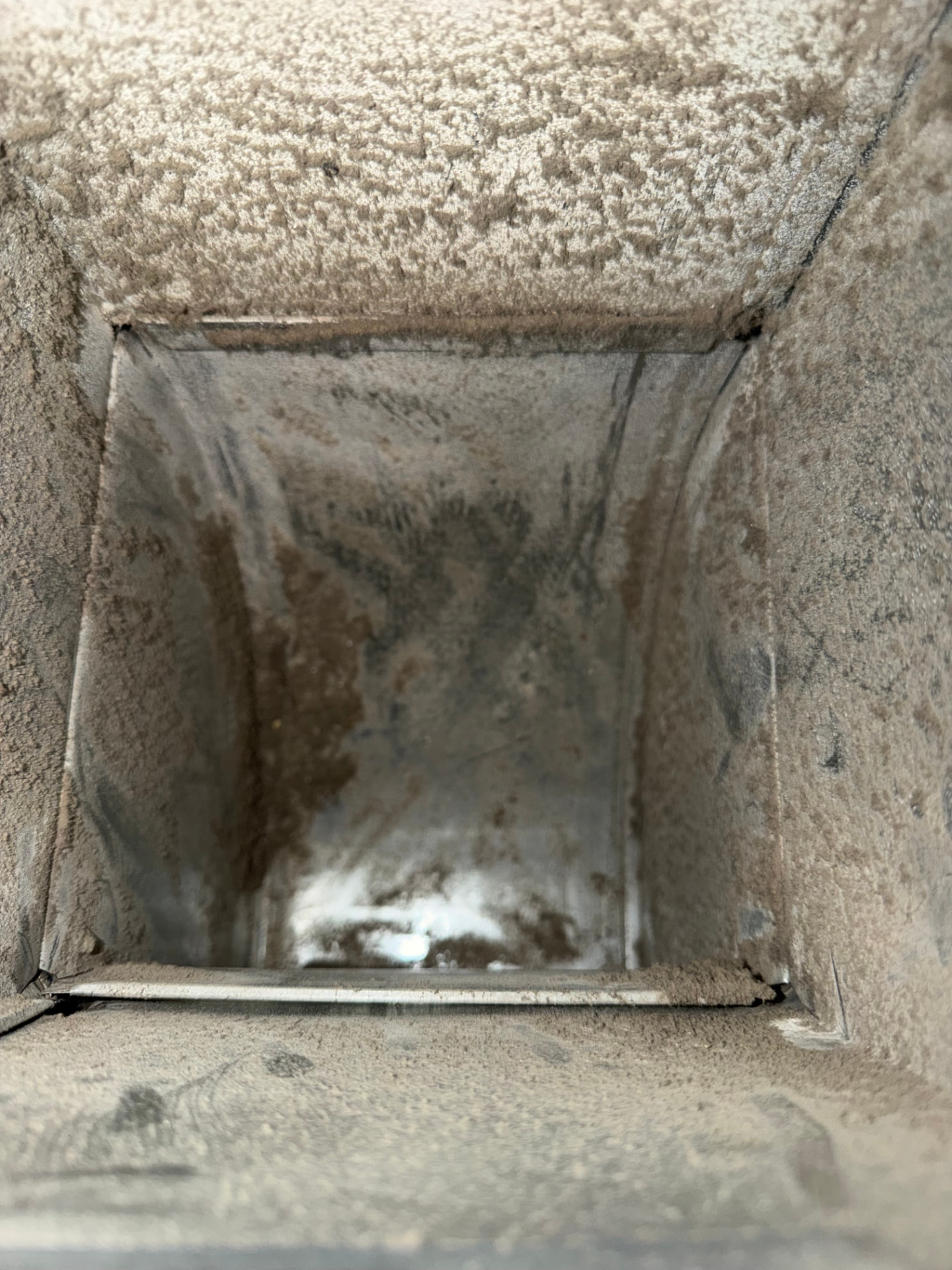 Air Duct Cleaning before Ridgeline cleaning — Dust-caked trunk line